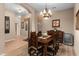 Charming dining room featuring wood furniture, a chandelier, and neutral wall colors at 6887 E Hacienda La Colorada Dr, Gold Canyon, AZ 85118
