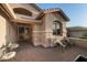 Welcoming home exterior featuring a tiled front patio and manicured landscaping with desert plants at 6887 E Hacienda La Colorada Dr, Gold Canyon, AZ 85118