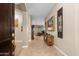 Inviting foyer with tile flooring, art decorations, and open view to the living room at 6887 E Hacienda La Colorada Dr, Gold Canyon, AZ 85118
