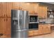 The kitchen includes a stainless refrigerator, built-in oven, and wood cabinets at 6887 E Hacienda La Colorada Dr, Gold Canyon, AZ 85118