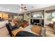 Cozy living room features ample seating, wooden accents, and an open floor plan at 6887 E Hacienda La Colorada Dr, Gold Canyon, AZ 85118