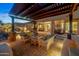 Charming outdoor living area featuring a pergola, comfortable seating, and patio at 6887 E Hacienda La Colorada Dr, Gold Canyon, AZ 85118