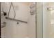 Bathroom featuring tile shower with grab bars, safety, and accessibility at 1021 S Greenfield Rd # 1194, Mesa, AZ 85206