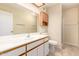 Bathroom vanity with modern sink, white countertop, and storage cabinets at 1021 S Greenfield Rd # 1194, Mesa, AZ 85206