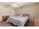 Cozy bedroom with ceiling fan, wood floor, and ample natural light at 1021 S Greenfield Rd # 1194, Mesa, AZ 85206