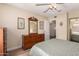 Bedroom features wood floors, closet with mirror doors, and doorway to hallway at 1021 S Greenfield Rd # 1194, Mesa, AZ 85206