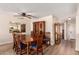 Dining room featuring wood floors, traditional wood dining set and cabinets at 1021 S Greenfield Rd # 1194, Mesa, AZ 85206