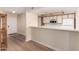 Open-concept kitchen featuring breakfast bar, white appliances, and ample counter space at 1021 S Greenfield Rd # 1194, Mesa, AZ 85206