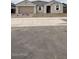 Charming single-story home with desert landscaping, a two-car garage, and a welcoming entrance at 14742 W Lariat Trl, Surprise, AZ 85387