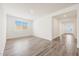 Bright living room showcasing modern finishes, wood tile flooring and natural light at 14742 W Lariat Trl, Surprise, AZ 85387
