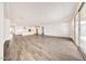 Expansive living space with tile flooring, seamlessly connecting the kitchen and living areas at 14742 W Lariat Trl, Surprise, AZ 85387