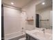 Cozy bathroom featuring a shower-tub combo, modern fixtures, and ample countertop space at 2030 E Michigan Ave # 4, Phoenix, AZ 85022