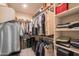Organized walk-in closet with shelving, hanging racks, and storage solutions for optimal organization at 2030 E Michigan Ave # 4, Phoenix, AZ 85022