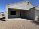 Backyard with covered patio, desert landscaping, and low maintenance yard at 3021 N 306Th Ln, Buckeye, AZ 85396