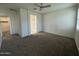 Large bedroom featuring neutral carpet and an en-suite bathroom at 3021 N 306Th Ln, Buckeye, AZ 85396