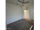 Bedroom with a neutral carpet, natural light, and access to an adjoining room and closet at 3021 N 306Th Ln, Buckeye, AZ 85396