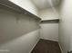 Walk-in closet with sturdy shelving and hanging rods to maximize storage capacity at 3021 N 306Th Ln, Buckeye, AZ 85396
