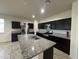 This kitchen offers granite counters, stainless appliances, and generous island for easy meal prep at 3021 N 306Th Ln, Buckeye, AZ 85396