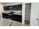 Modern kitchen features stainless steel appliances and ample countertop space for cooking at 3021 N 306Th Ln, Buckeye, AZ 85396