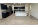 Well-lit kitchen features granite counters and lots of storage and countertop space at 3021 N 306Th Ln, Buckeye, AZ 85396