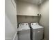 Functional laundry room with shelving and appliances included at 3021 N 306Th Ln, Buckeye, AZ 85396