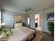 Inviting main bedroom with neutral tones, ceiling fan, and ensuite bathroom access at 3021 N 306Th Ln, Buckeye, AZ 85396