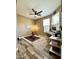 Bedroom with a computer desk, ceiling fan, wood-look floors, and fitness equipment at 3021 W Trapanotto Rd, Phoenix, AZ 85086