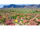 Community aerial view showcasing desert landscaping, tile roofs, and stunning mountain views at 7701 E Golden Eagle Cir, Gold Canyon, AZ 85118