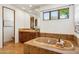 A spacious bathroom showcases a soaking tub, a glass shower, a vanity, and a private toilet area at 7701 E Golden Eagle Cir, Gold Canyon, AZ 85118