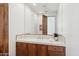 Bathroom featuring wooden cabinets, neutral tile countertops, and contemporary fixtures at 7701 E Golden Eagle Cir, Gold Canyon, AZ 85118