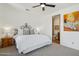 Bedroom featuring a decorative iron bedframe, and a view into an en-suite bathroom at 7701 E Golden Eagle Cir, Gold Canyon, AZ 85118