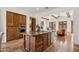 Modern kitchen with island and stainless steel appliances open to the living room with a fireplace at 7701 E Golden Eagle Cir, Gold Canyon, AZ 85118