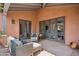 A private patio offers outdoor seating and access to the home's interior through glass doors at 7701 E Golden Eagle Cir, Gold Canyon, AZ 85118
