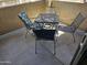 Outdoor patio seating area with a metal table and chairs at 10136 E Southern Ave # 2048, Mesa, AZ 85209