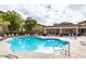 Resort-style pool area with lounge chairs, covered pavilion, and lush landscaping at 10136 E Southern Ave # 2048, Mesa, AZ 85209
