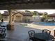 Community pool with shaded lounge area, and view of adjacent community buildings at 10136 E Southern Ave # 2048, Mesa, AZ 85209