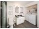 Modern bathroom featuring a shower with glass door, gray tile, and a vanity with marble top at 1108 N Esther St, Tempe, AZ 85288
