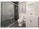 Contemporary bathroom featuring gray tile shower, sleek vanity, and modern fixtures at 1108 N Esther St, Tempe, AZ 85288
