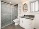 Modern bathroom featuring a glass shower, marble countertop, and white vanity with stylish fixtures at 1108 N Esther St, Tempe, AZ 85288