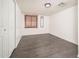 Comfortable bedroom with gray flooring, white walls, closet and a bright window with wood blinds at 1108 N Esther St, Tempe, AZ 85288