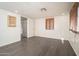 Cozy bedroom with gray flooring, a window with wood blinds, and fresh, white walls at 1108 N Esther St, Tempe, AZ 85288