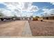 Charming single-story home with an expansive gravel front yard and gray paver pathway under a bright sunny sky at 1108 N Esther St, Tempe, AZ 85288