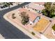 Aerial view of home with desert landscaping, block wall, and patio at 11343 W Mccaslin Rose Ln, Surprise, AZ 85378