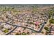 Wide aerial view of neighborhood and home with location pin at 11343 W Mccaslin Rose Ln, Surprise, AZ 85378