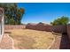 Backyard view features desert landscaping, block wall, and gravel at 11343 W Mccaslin Rose Ln, Surprise, AZ 85378
