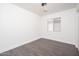 Empty bedroom with hardwood floors and a window at 11343 W Mccaslin Rose Ln, Surprise, AZ 85378