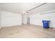 Spacious garage with ample storage, water heater and door to outside at 11343 W Mccaslin Rose Ln, Surprise, AZ 85378