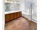 Bright bathroom with a large mirror, a soaking tub, and a walk-in shower at 12644 N 152Nd Ave, Surprise, AZ 85379