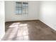 Empty bedroom featuring tile floors, a window with blinds and white walls at 12644 N 152Nd Ave, Surprise, AZ 85379