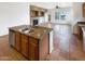 Kitchen featuring granite countertops and an island with a sink and dishwasher at 12644 N 152Nd Ave, Surprise, AZ 85379
